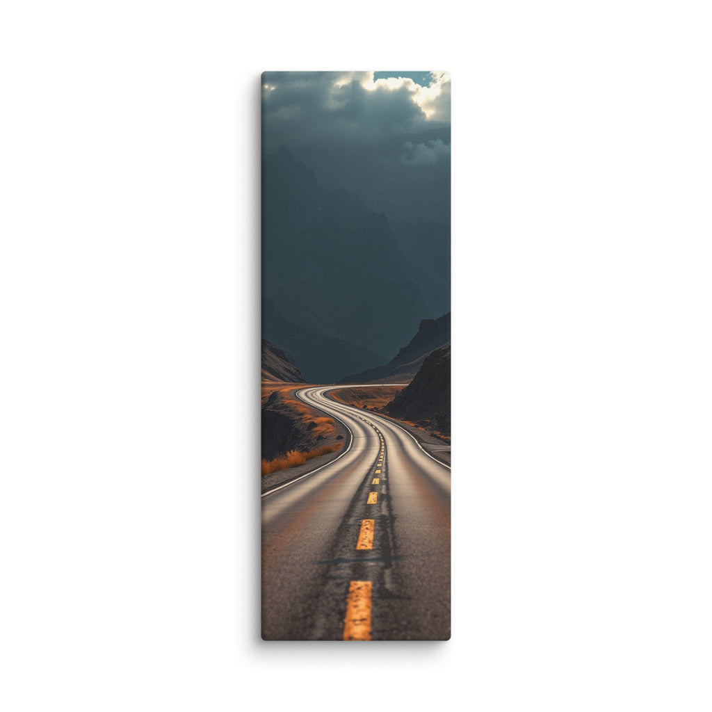 Beneath The Dark Summit, tall wrapped canvas print: a winding road through a dark mountain valley beneath brooding blue-grey peaks.