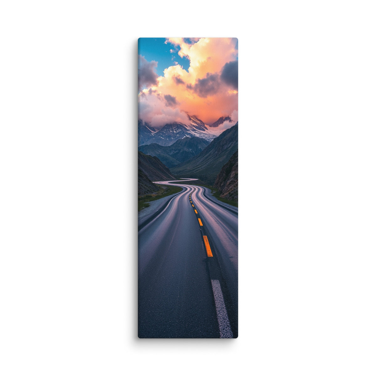 The Rose Lit Summit, tall wrapped canvas print: a serpentine road through a valley toward snow peaks under rose-pink sunset clouds.