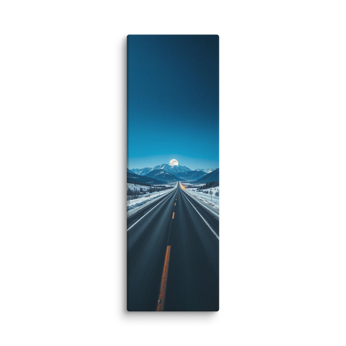 Moon At The Ridgeline, tall wrapped canvas print: a full moon rising over a snow-capped ridgeline at the end of a long straight winter road.