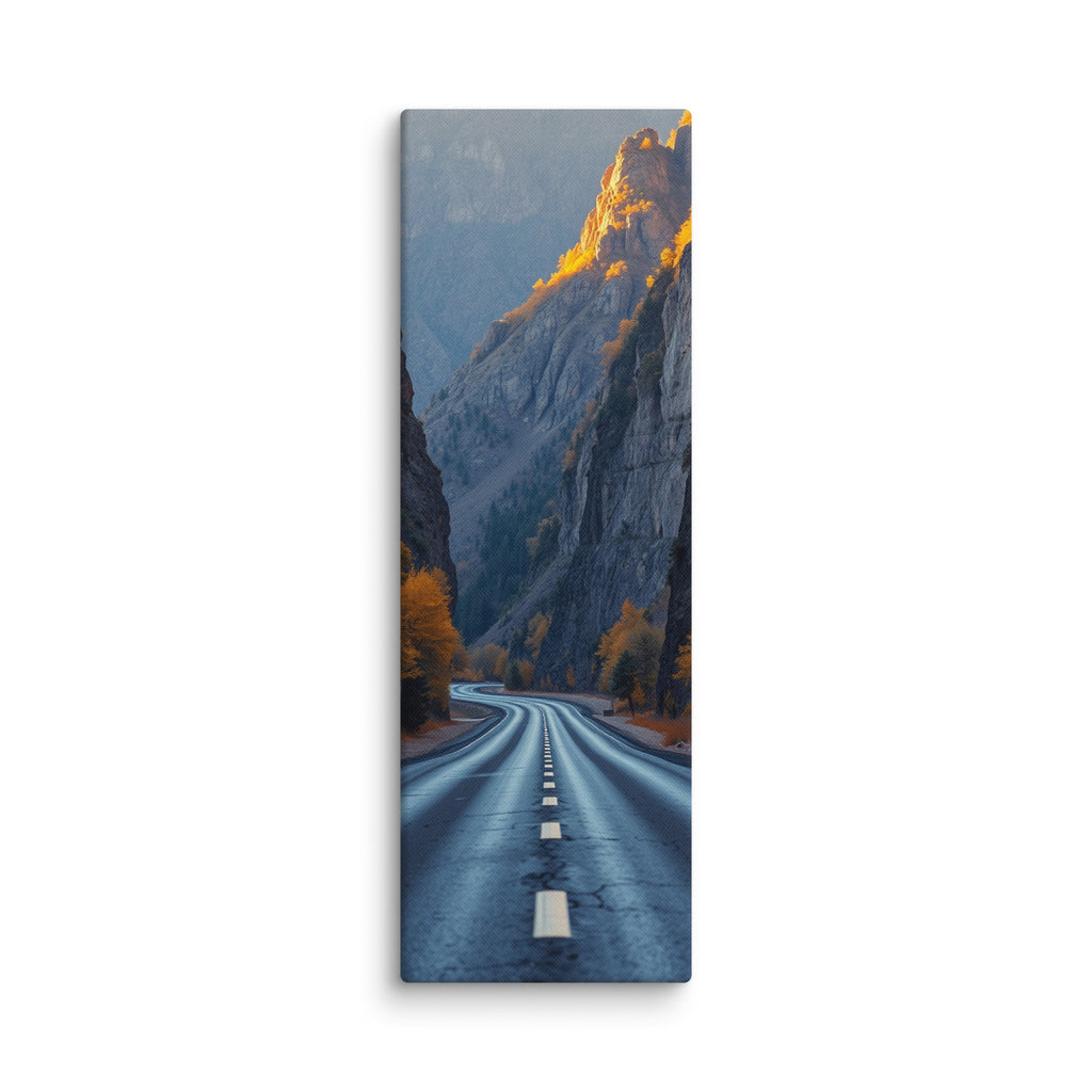 The Gilded Ramparts, tall wrapped canvas print: a road through a canyon with golden evening light gilding the upper cliffs and autumn trees.