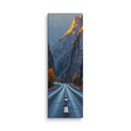 The Gilded Ramparts, tall wrapped canvas print: a road through a canyon with golden evening light gilding the upper cliffs and autumn trees.