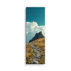 Steps To The Sky, tall wrapped canvas print: a stone path climbing a golden grassy slope toward a dark rocky summit.