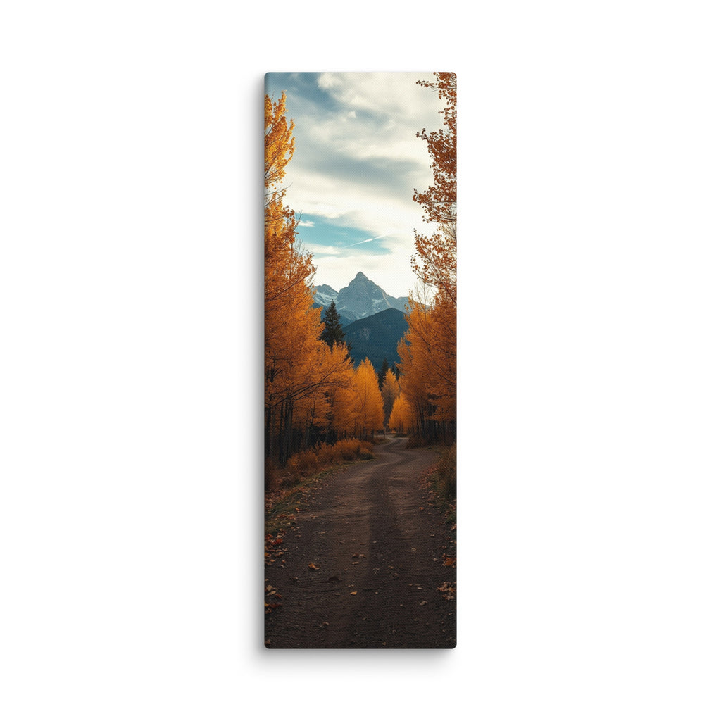 The Peak Beyond The Trees, tall wrapped canvas print: a dirt road through golden autumn trees toward a distant rocky peak.