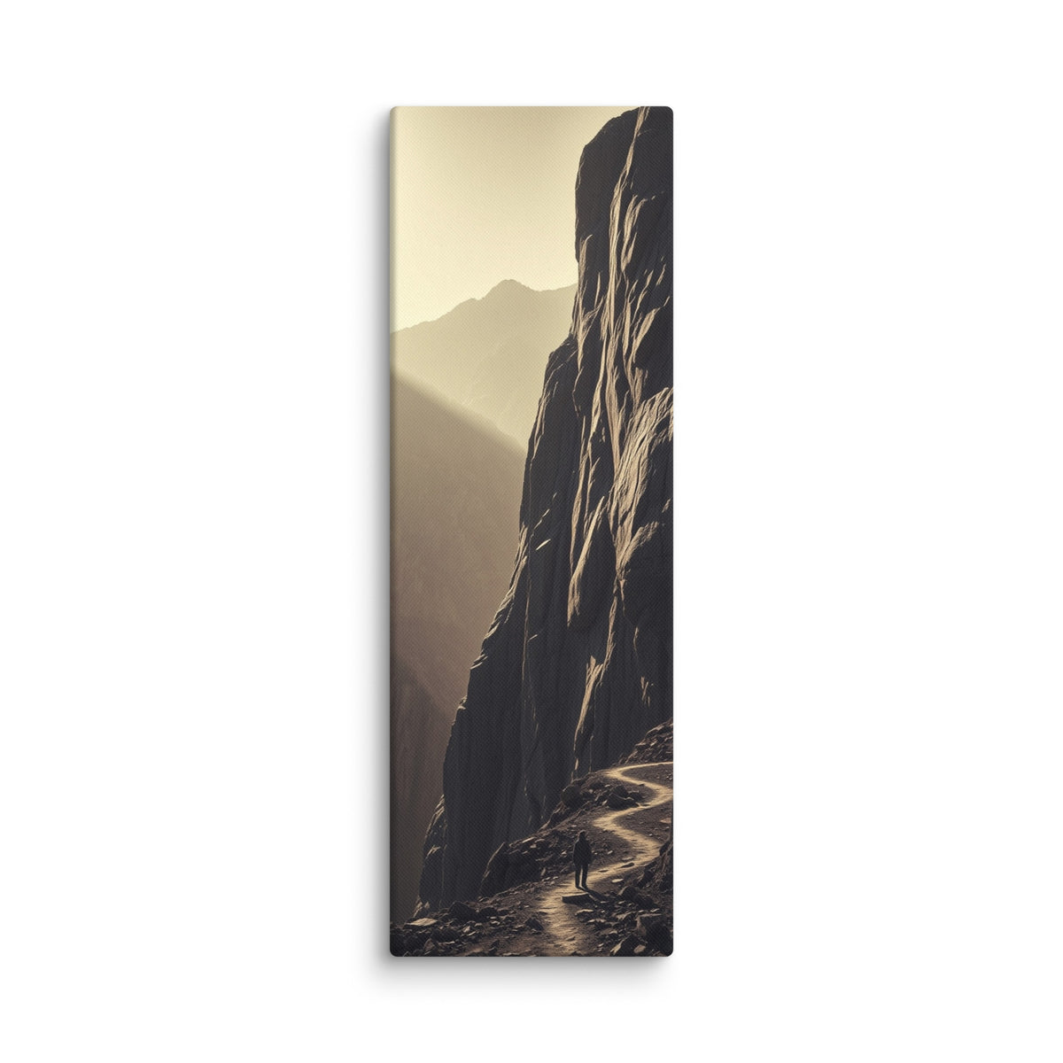 The Ascending Light, tall wrapped canvas print: a lone figure on a winding cliff path as golden light climbs a mountain ridge.
