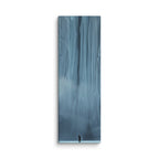 Blue Citadel, tall wrapped canvas print: a lone figure before an immense wall of pale blue ice columns rising into mist.