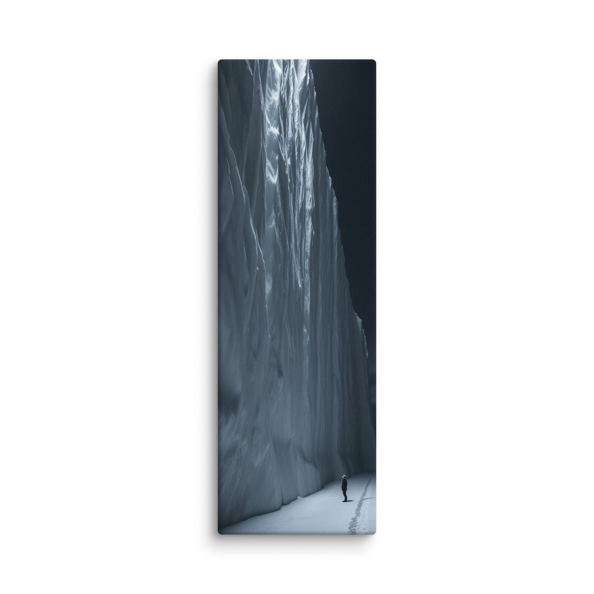 Nightfall Cascade, tall wrapped canvas print: a glowing blue frozen waterfall wall at night with a lone figure and footprints in the snow.