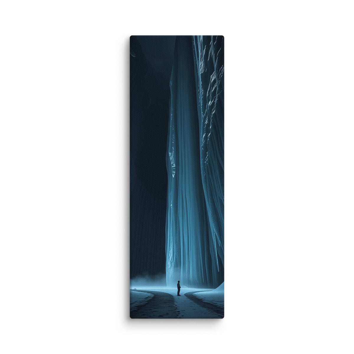 The Blue Divide, tall wrapped canvas print: a lone figure on a snowy path before a colossal glowing blue frozen waterfall between dark ice walls.