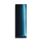 The Blue Vein, tall wrapped canvas print: an electric-blue frozen waterfall glowing in darkness with a lone silhouetted figure.